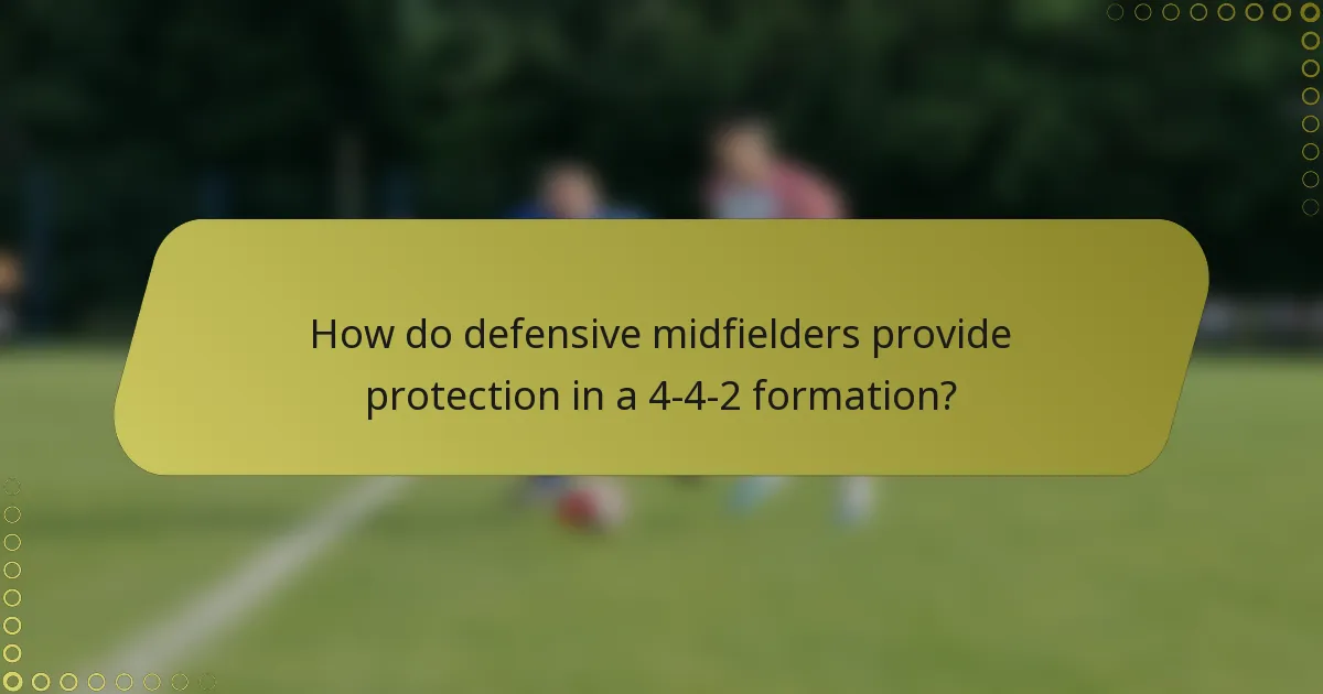 How do defensive midfielders provide protection in a 4-4-2 formation?